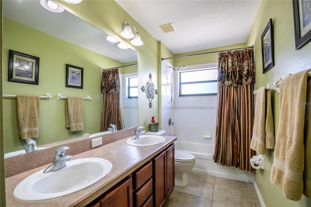 full bathroom with shower / bathtub combination with curtain, tile patterned floors, a textured ceiling, toilet, and vanity