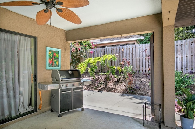 view of patio featuring ceiling fan and a grill