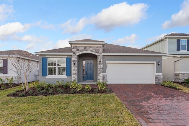 view of front of house with a garage and a front lawn