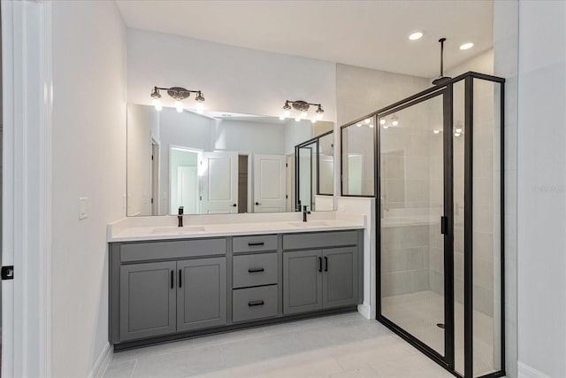 bathroom with tile patterned flooring, vanity, and an enclosed shower