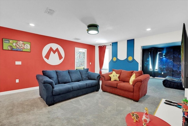 living area with visible vents, baseboards, and carpet floors