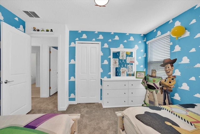 bedroom featuring visible vents, baseboards, wallpapered walls, a closet, and carpet flooring