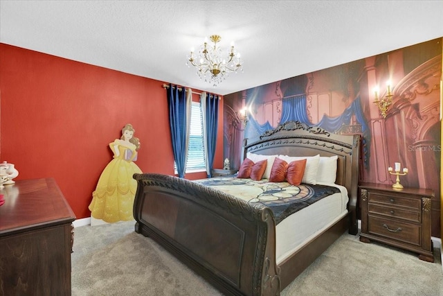carpeted bedroom with an accent wall, a notable chandelier, and baseboards