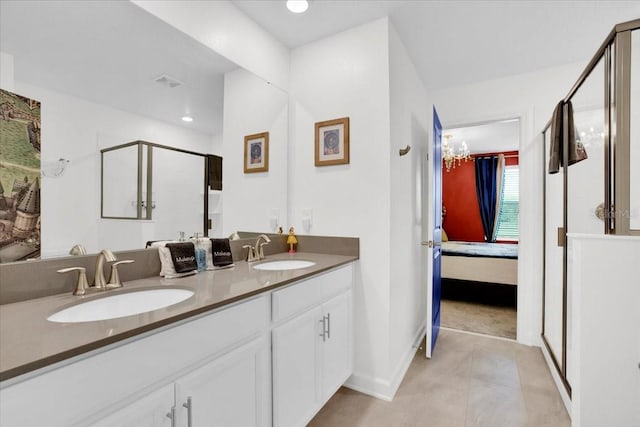 ensuite bathroom featuring a sink, a stall shower, ensuite bath, and double vanity