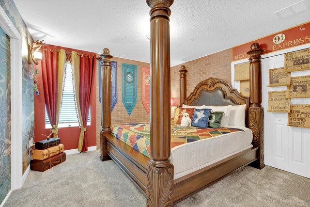 bedroom featuring carpet flooring and a textured ceiling