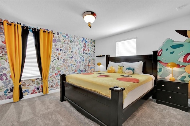 bedroom with baseboards and carpet floors