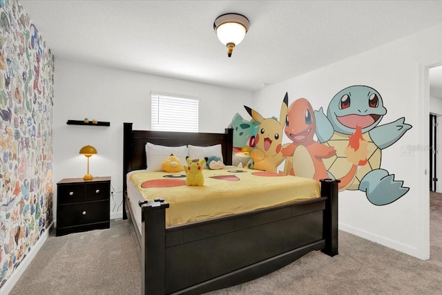 carpeted bedroom featuring baseboards