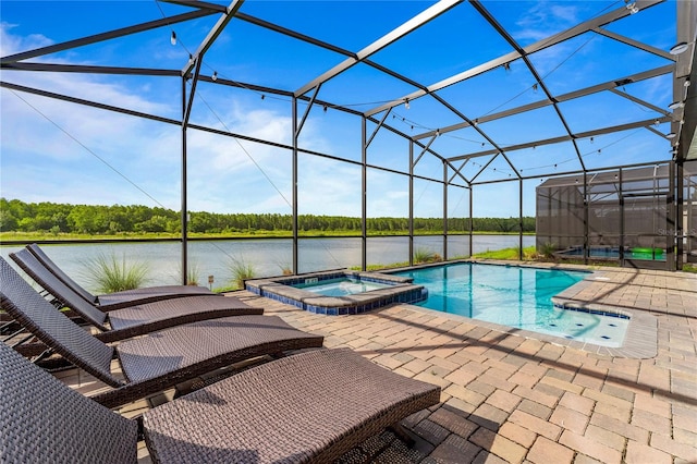 view of pool featuring glass enclosure, an in ground hot tub, and a patio