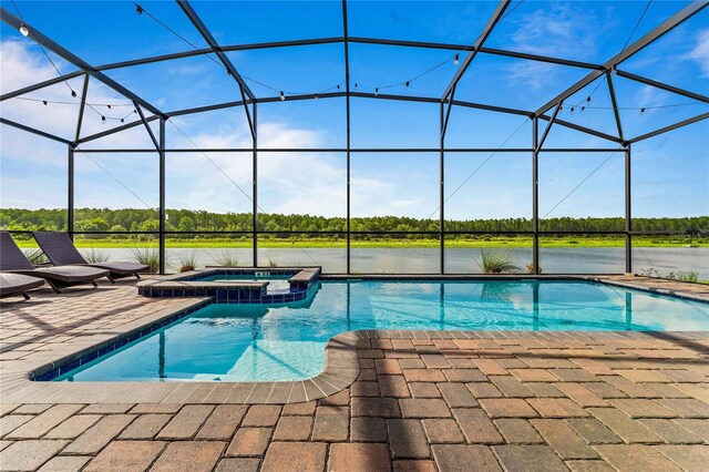 view of swimming pool with glass enclosure, an in ground hot tub, and a patio area