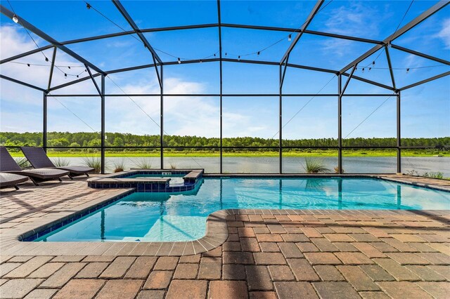 view of swimming pool with a patio, a lanai, and a pool with connected hot tub
