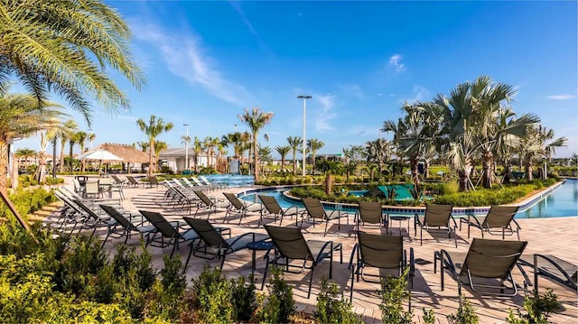 view of swimming pool featuring a patio area