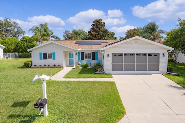 single story home with a front lawn, covered porch, a garage, and solar panels