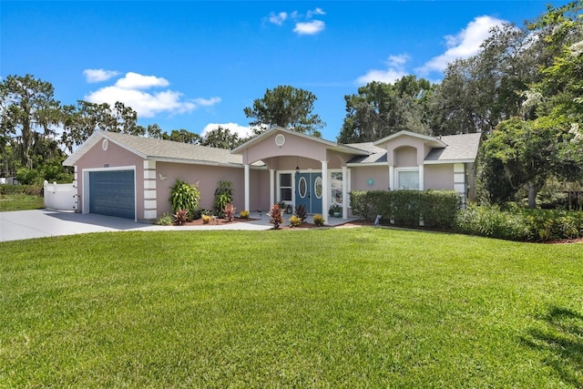 single story home with a garage and a front lawn