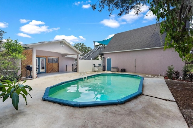 view of swimming pool with a patio area