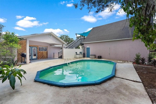 view of swimming pool with a patio