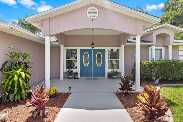 property entrance featuring a porch