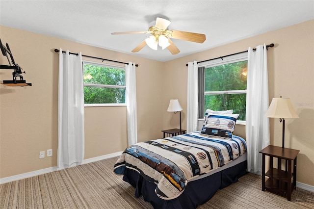 carpeted bedroom featuring ceiling fan