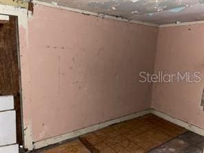 1605 Rose Ln, Eustis, FL 32726 - empty room featuring baseboards
