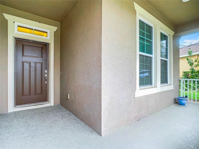 property entrance with covered porch