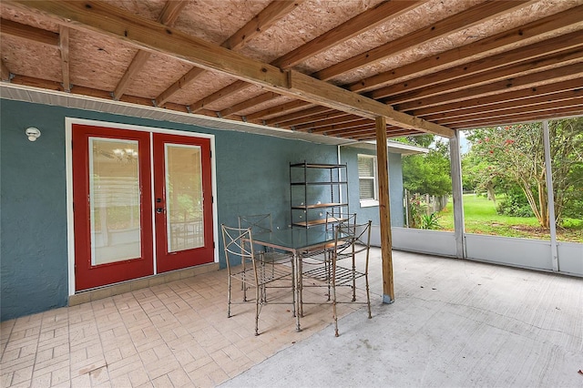 unfurnished sunroom featuring french doors