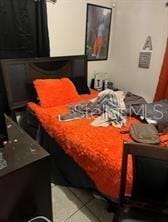 bedroom featuring light tile patterned floors