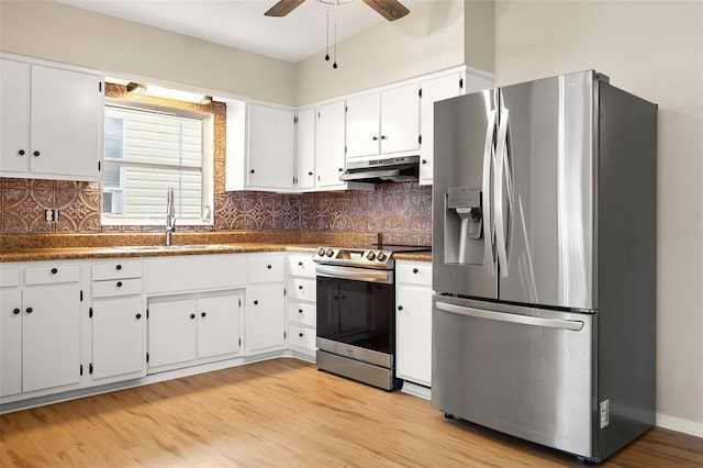 kitchen featuring appliances with stainless steel finishes, ceiling fan, sink, light hardwood / wood-style flooring, and white cabinets