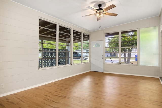 unfurnished room with ceiling fan and wood-type flooring