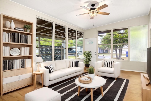 sunroom / solarium featuring ceiling fan