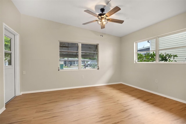 empty room featuring ceiling fan and light hardwood / wood-style flooring