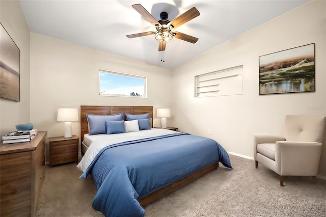 bedroom with carpet flooring, ceiling fan, and vaulted ceiling