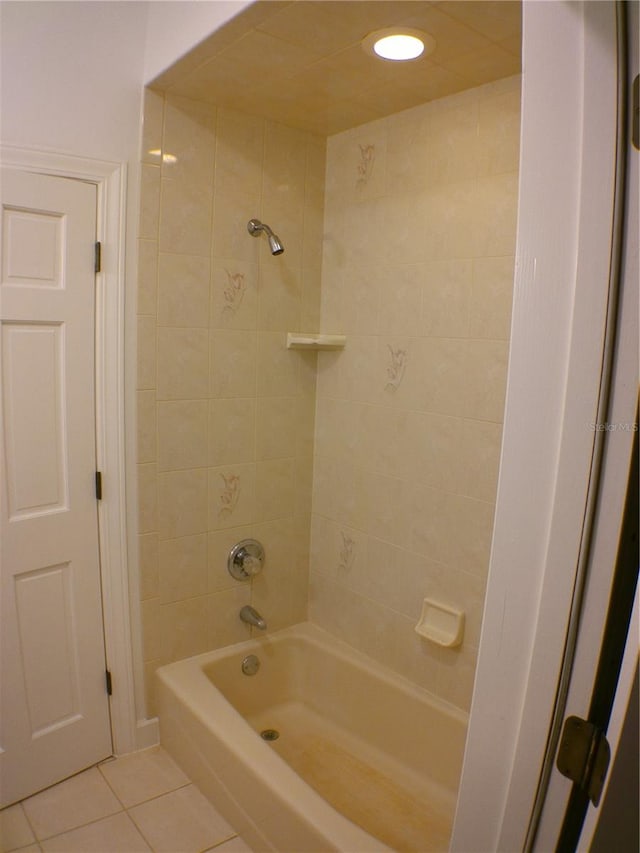 bathroom with tile patterned flooring and tiled shower / bath