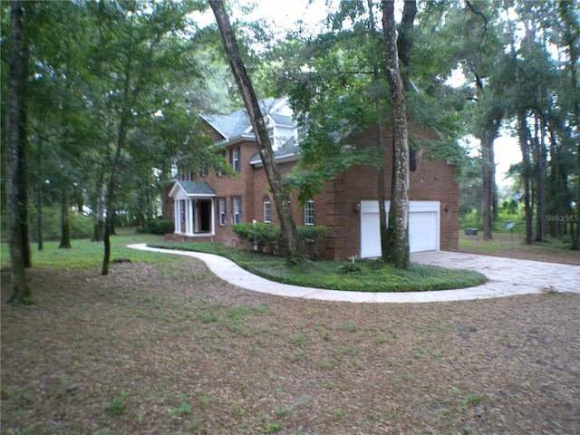 view of side of property with a garage