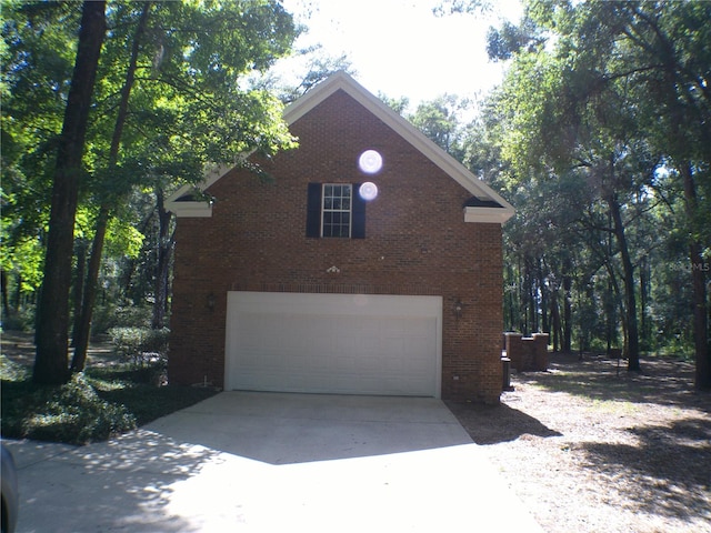 view of side of property featuring a garage