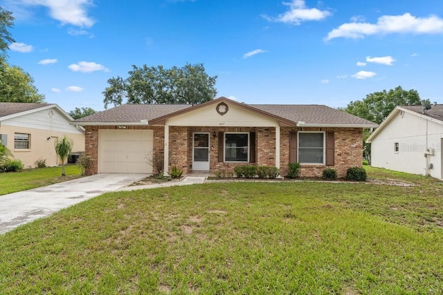 single story home with a garage and a front lawn