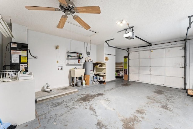 garage with a garage door opener, sink, electric water heater, ceiling fan, and heating unit