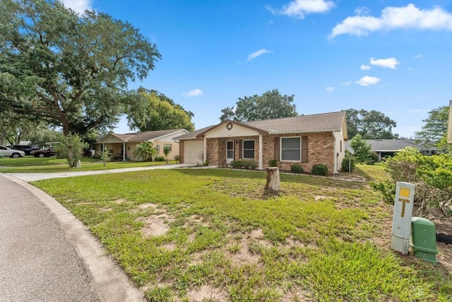 ranch-style house with a garage and a front lawn