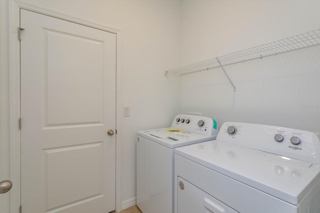 laundry area featuring independent washer and dryer