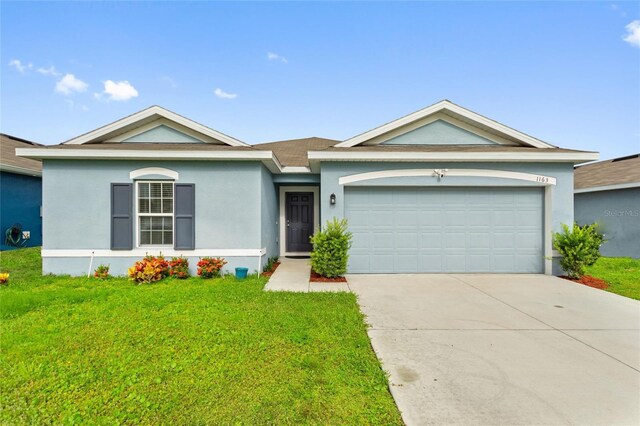 ranch-style house with a front lawn and a garage