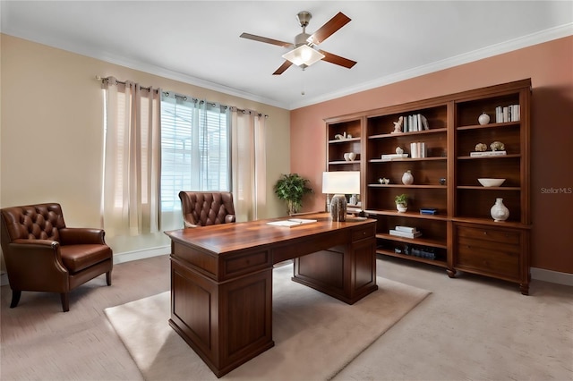 home office with light colored carpet, ceiling fan, and crown molding