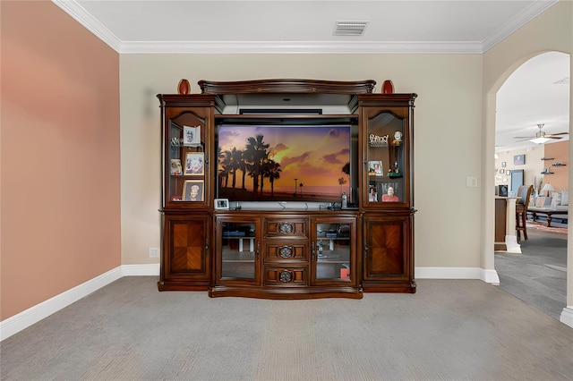 living room with carpet flooring, ceiling fan, and crown molding