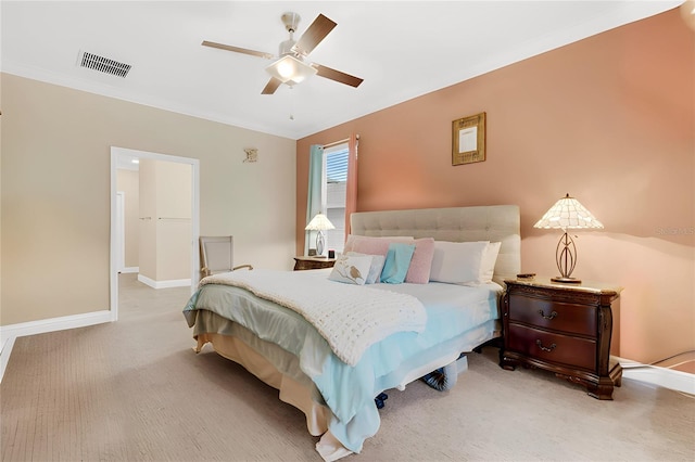 bedroom featuring ornamental molding, carpet floors, and ceiling fan