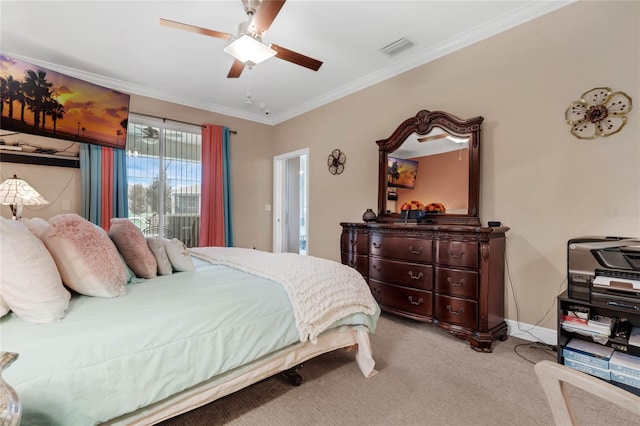 carpeted bedroom with crown molding and ceiling fan