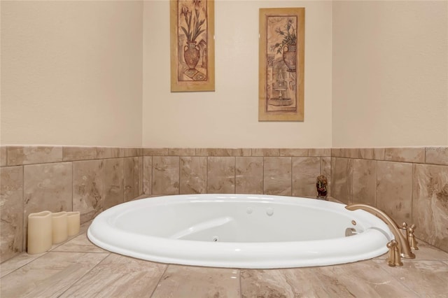 bathroom with tiled bath