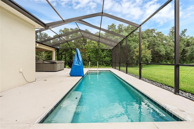 view of swimming pool featuring glass enclosure, a patio area, a yard, and a hot tub