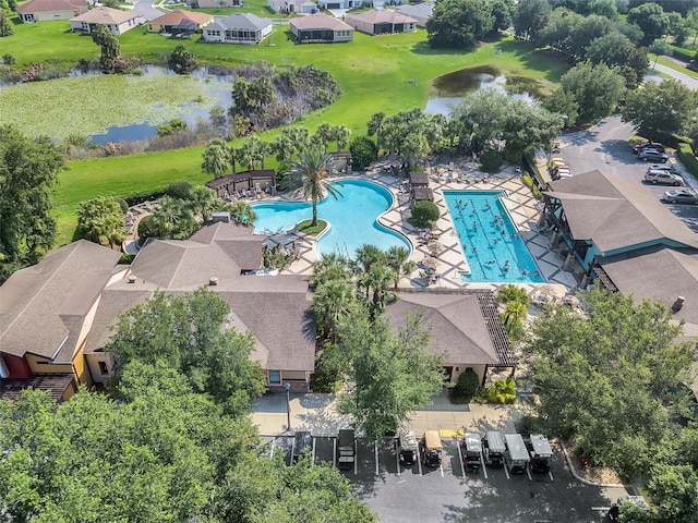 birds eye view of property with a water view