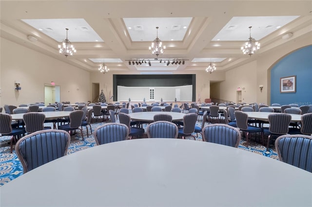 dining space with beam ceiling, a towering ceiling, coffered ceiling, and a chandelier