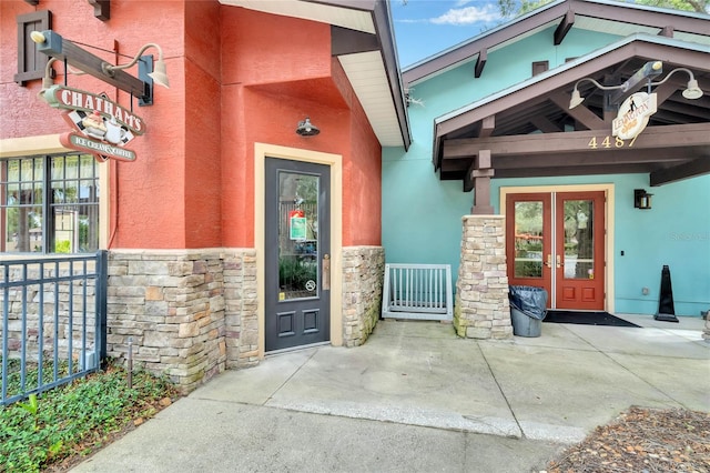 entrance to property featuring french doors