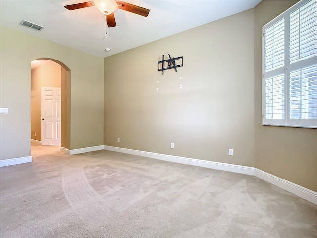 unfurnished room with carpet flooring and ceiling fan