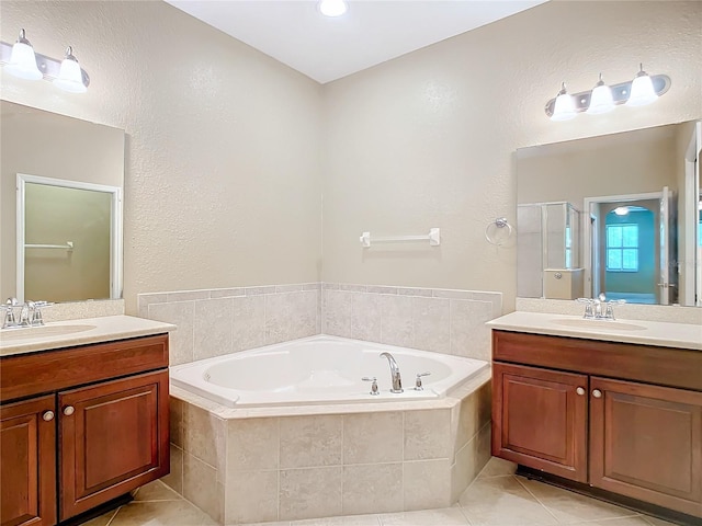 bathroom with vanity, separate shower and tub, and tile patterned floors