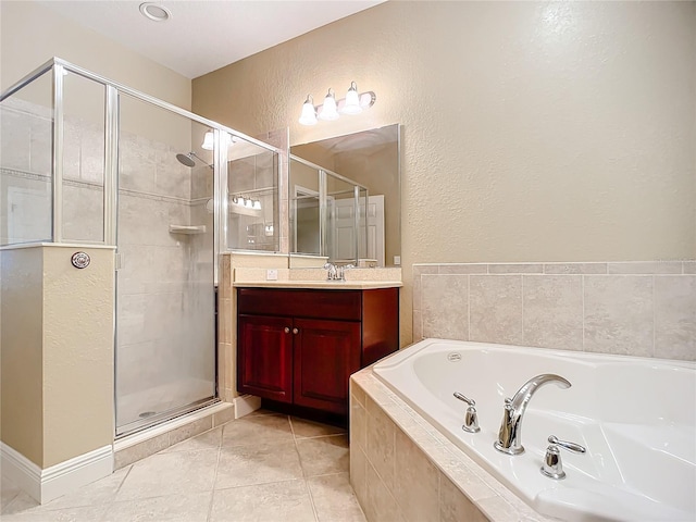 bathroom with plus walk in shower, vanity, and tile patterned floors